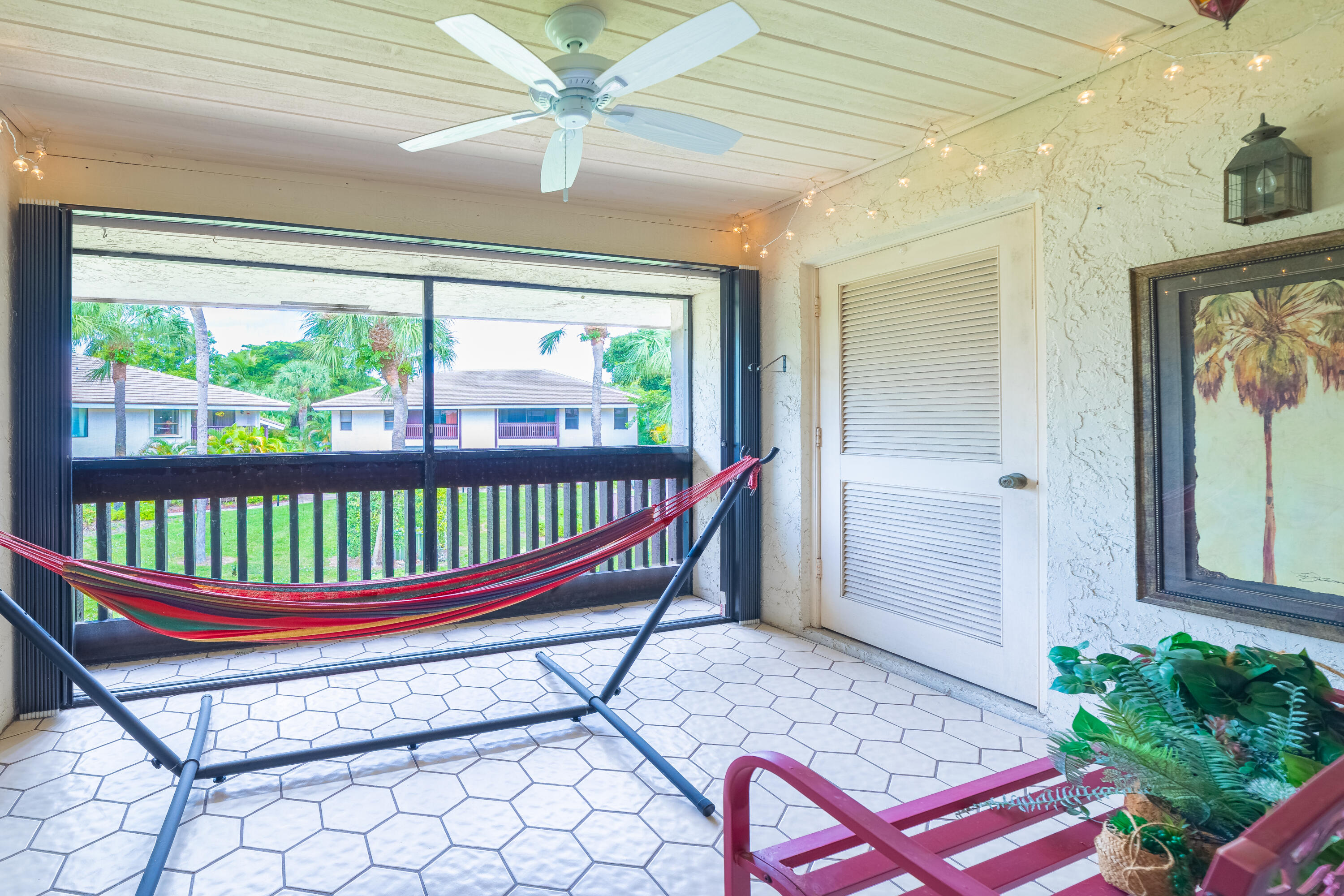 9352 Sable Ridge Circle, Unit B Boca Raton, FL 33428 - Photo 25 of 35 a room that has a bench and a table
