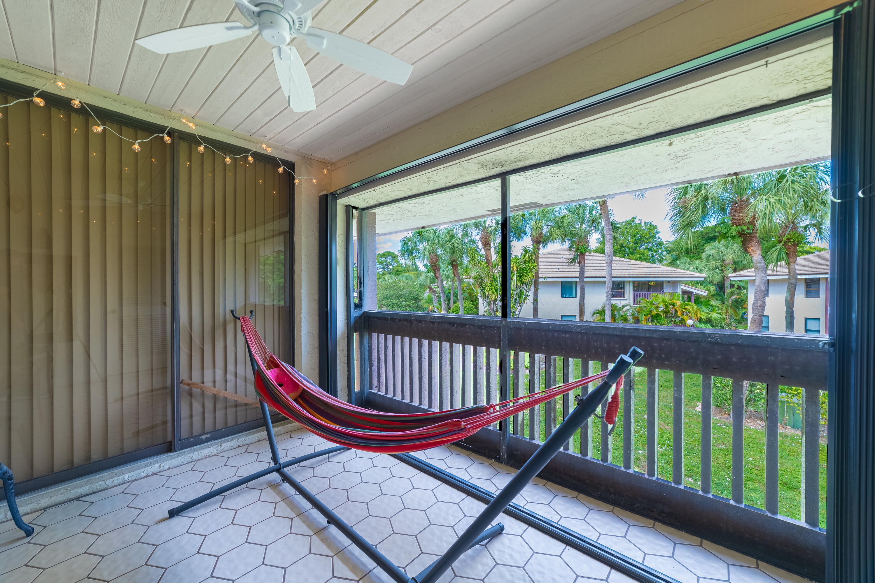 9352 Sable Ridge Circle, Unit B Boca Raton, FL 33428 - Photo 26 of 35 a view of a two chairs in the balcony