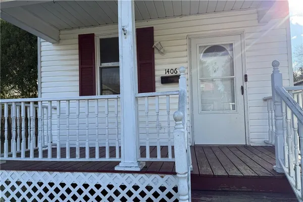 a view of a balcony with wooden floor