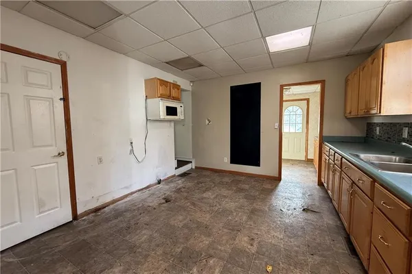 a view of a kitchen with electric appliances