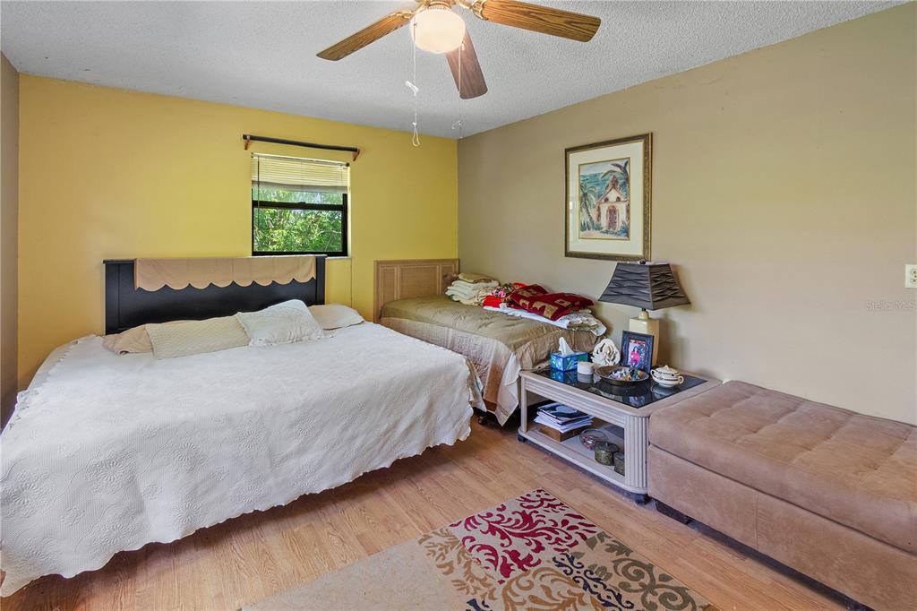 1360 Collany Lane Frostproof, FL 33843 - Photo 11 of 55 a bedroom with a bed and a window