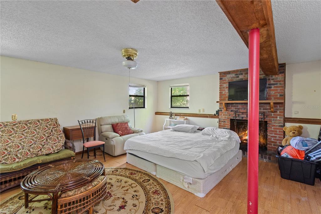 1360 Collany Lane Frostproof, FL 33843 - Photo 15 of 55 a bedroom with a bed and a couch