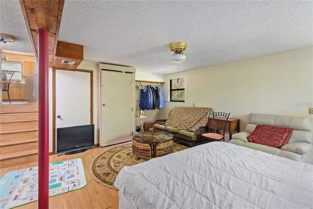 1360 Collany Lane Frostproof, FL 33843 - Photo 17 of 55 a bedroom with two beds and a lamp