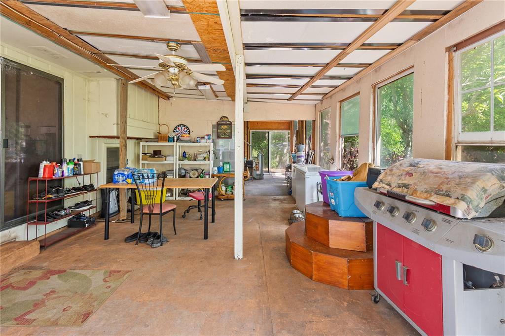 1360 Collany Lane Frostproof, FL 33843 - Photo 19 of 55 a living room with furniture a flat screen tv and a table