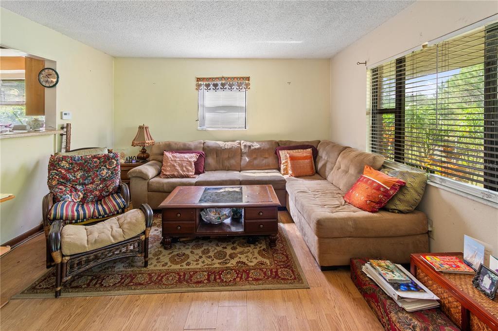 1360 Collany Lane Frostproof, FL 33843 - Photo 2 of 55 a living room with furniture or couch and a large window