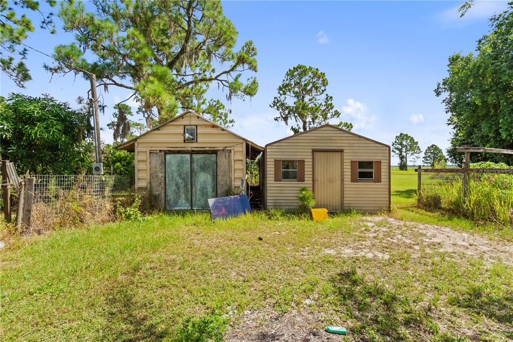 1360 Collany Lane Frostproof, FL 33843 - Photo 26 of 55 a front view of a house with a garden