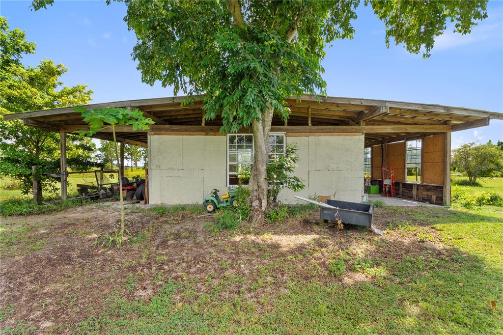 1360 Collany Lane Frostproof, FL 33843 - Photo 29 of 55 a front view of a house with garden