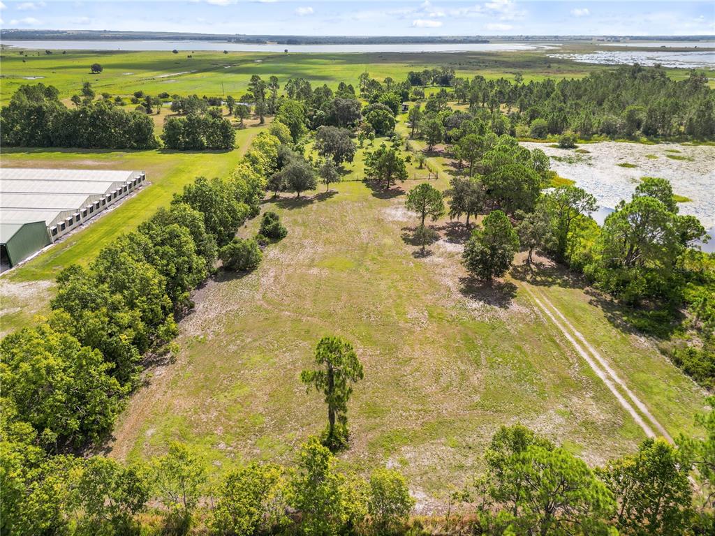 1360 Collany Lane Frostproof, FL 33843 - Photo 34 of 55 a view of a garden with an ocean beach