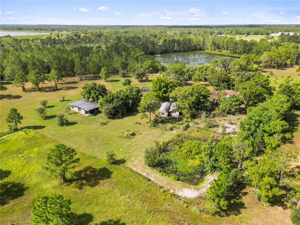 1360 Collany Lane Frostproof, FL 33843 - Photo 39 of 55 a view of a lake with a mountain in the background