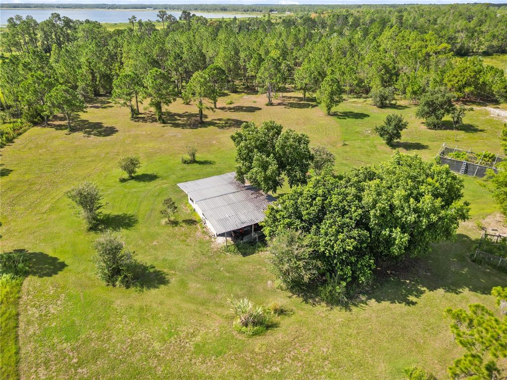 1360 Collany Lane Frostproof, FL 33843 - Photo 40 of 55 a view of a lake with a yard