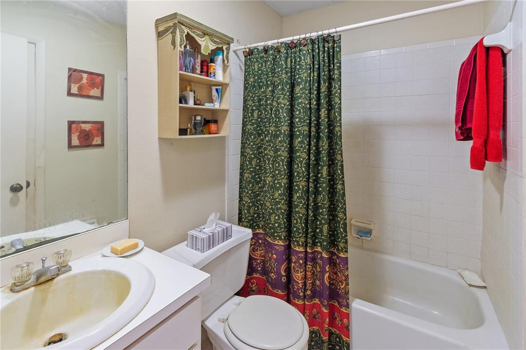 1360 Collany Lane Frostproof, FL 33843 - Photo 8 of 55 a bathroom with a sink toilet and shower