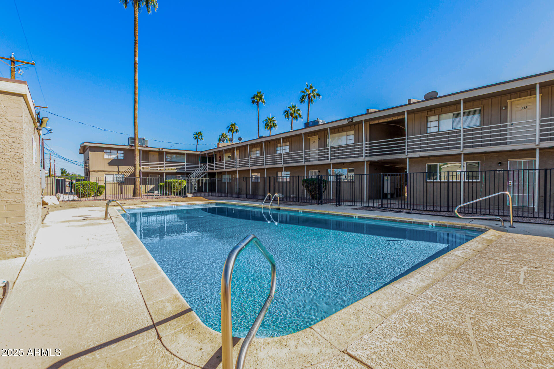 2150 West Missouri Avenue, Unit 108 Phoenix, AZ 85015 - Photo 26 of 28 a view of a house with a swimming pool