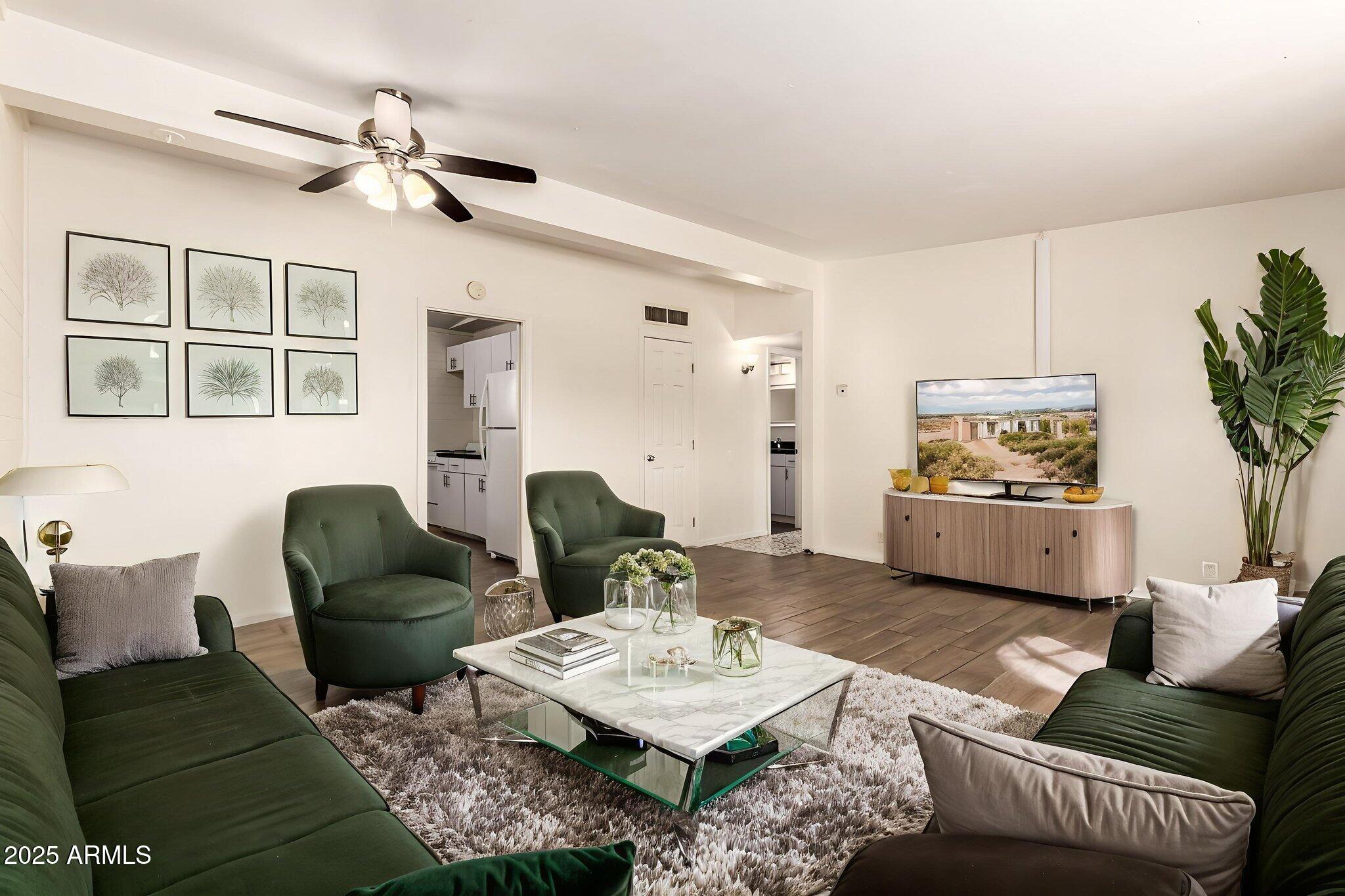2150 West Missouri Avenue, Unit 108 Phoenix, AZ 85015 - Photo 2 of 28 a living room with furniture and a table