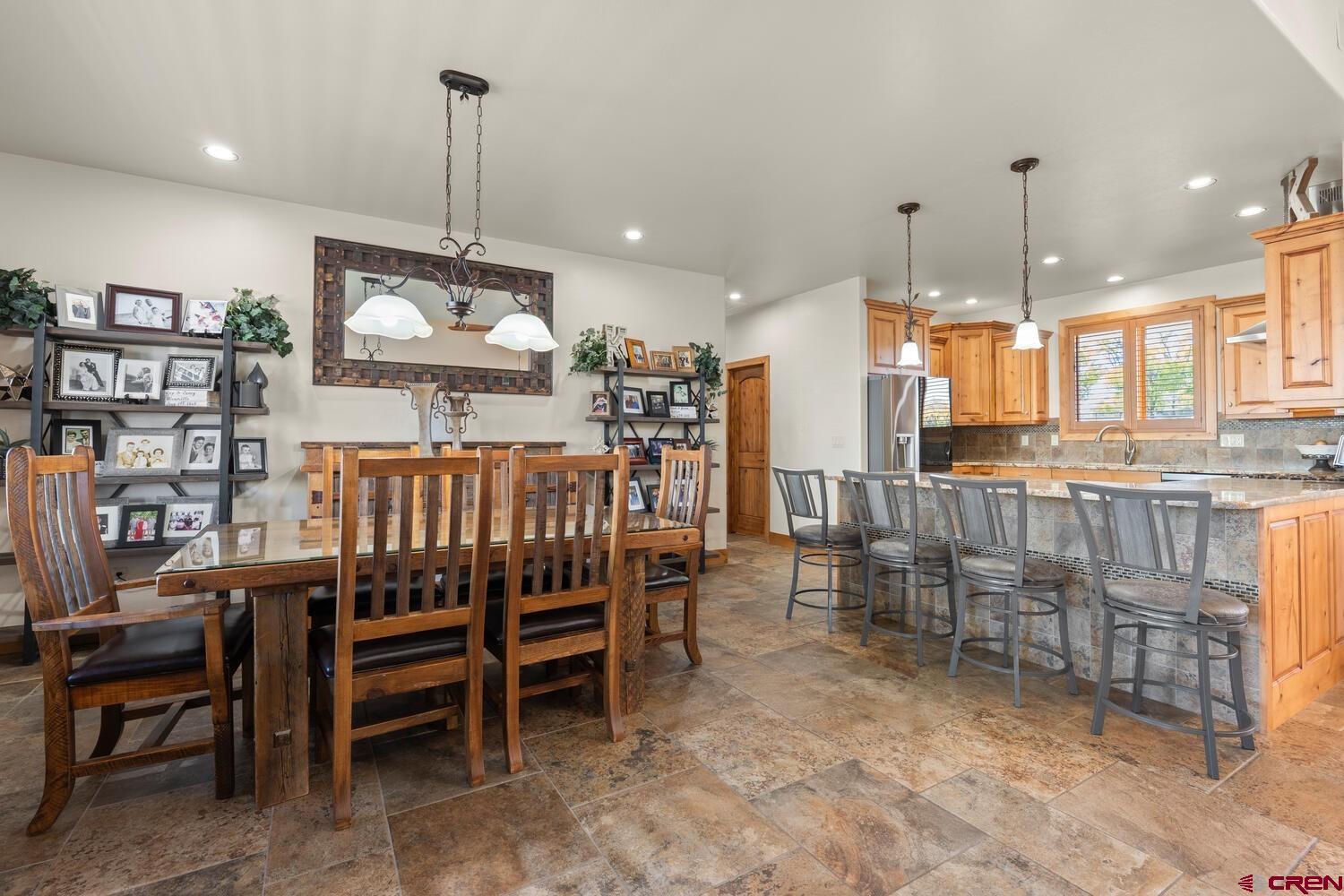 60075-60085 Oak Grove Road Montrose, CO 81403 - Photo 11 of 44 a view of a dining room with furniture