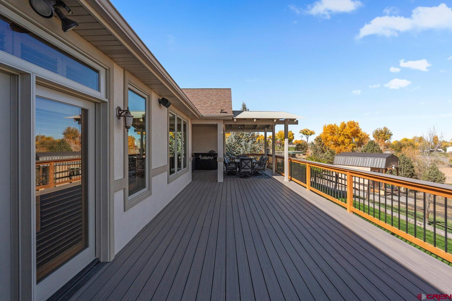 60075-60085 Oak Grove Road Montrose, CO 81403 - Photo 20 of 44 a view of a balcony with wooden floor