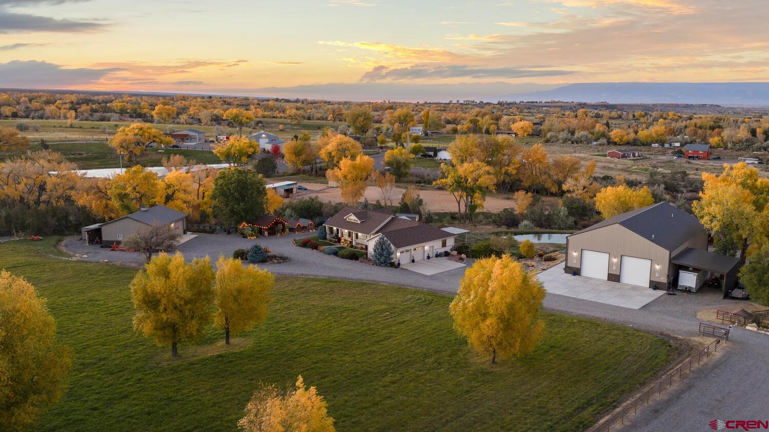 60075-60085 Oak Grove Road Montrose, CO 81403 - Photo 2 of 44 a view of a lake with a mountain
