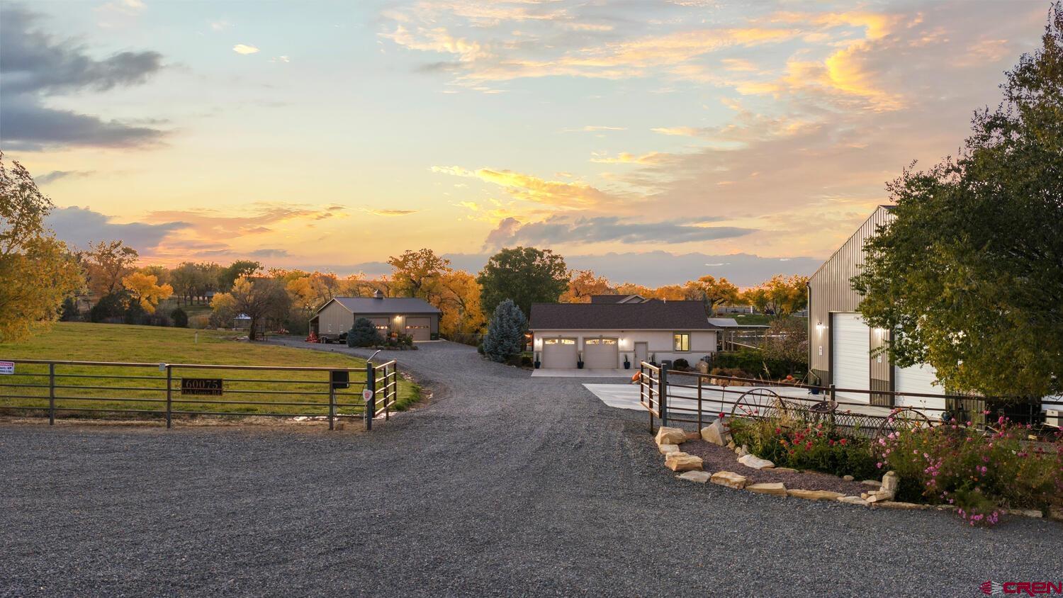 60075-60085 Oak Grove Road Montrose, CO 81403 - Photo 3 of 44 a view of a bench in front of a house