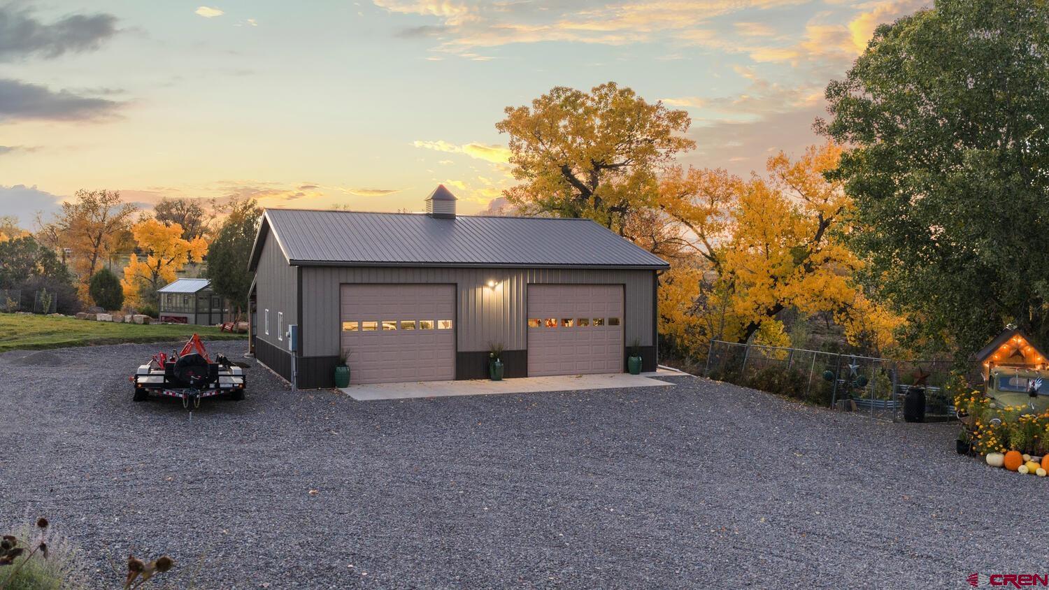 60075-60085 Oak Grove Road Montrose, CO 81403 - Photo 39 of 44 a view of a car parked in front of a house