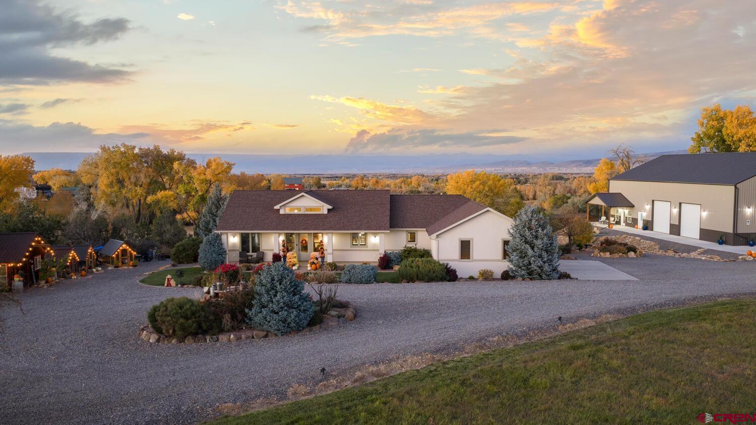 60075-60085 Oak Grove Road Montrose, CO 81403 - Photo 4 of 44 an aerial view of a house