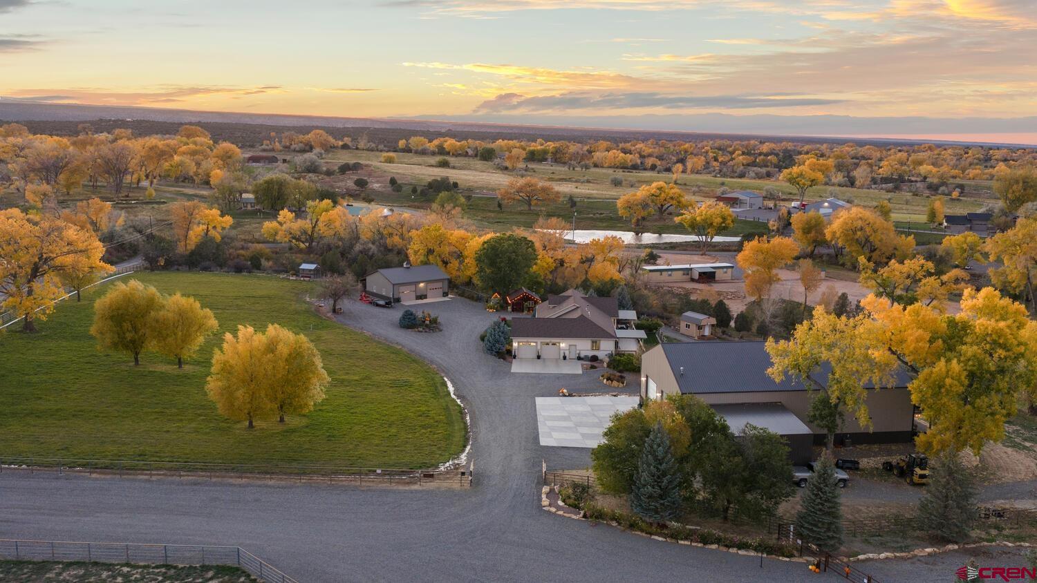 60075-60085 Oak Grove Road Montrose, CO 81403 - Photo 43 of 44 an aerial view of a residential houses with outdoor space and ocean view
