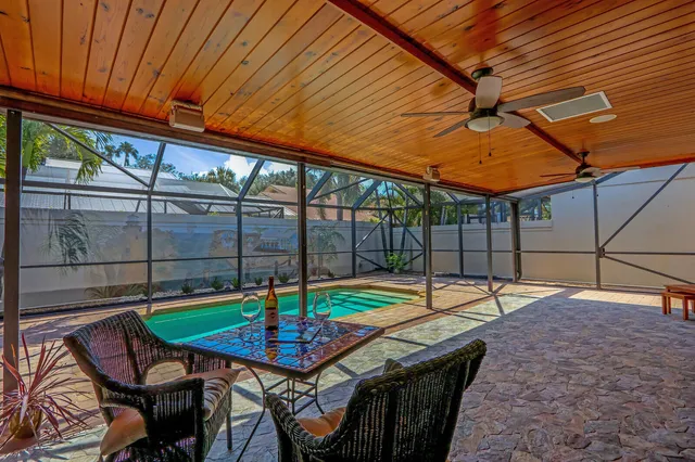 a backyard of a house with barbeque oven table and chairs