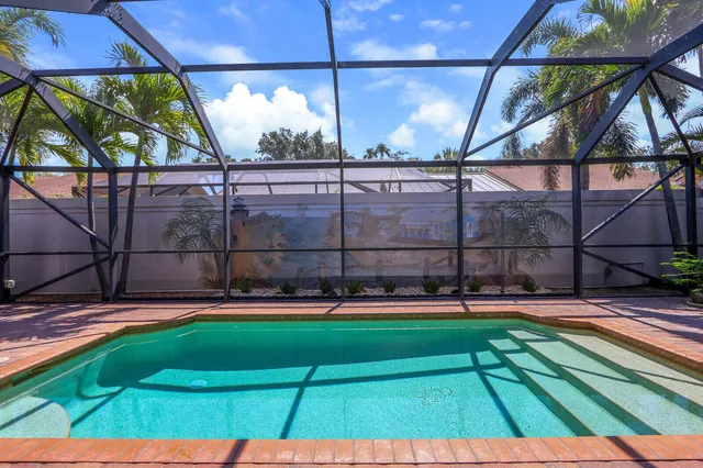 a view of a backyard with a swimming pool