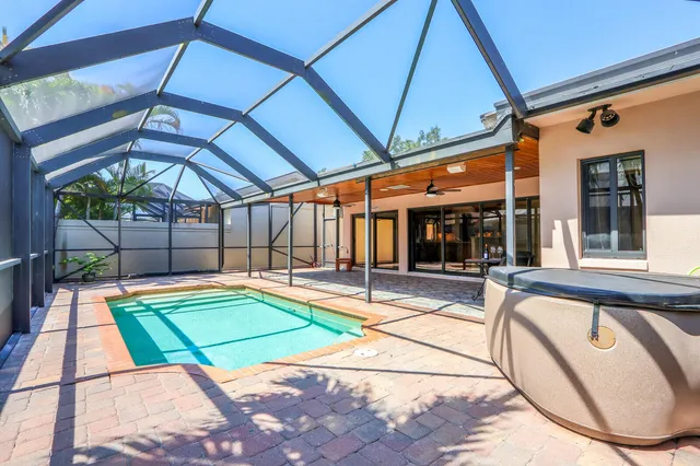 a view of swimming pool with a patio