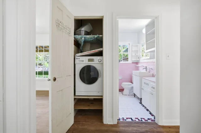 a view of a hallway with washer and dryer