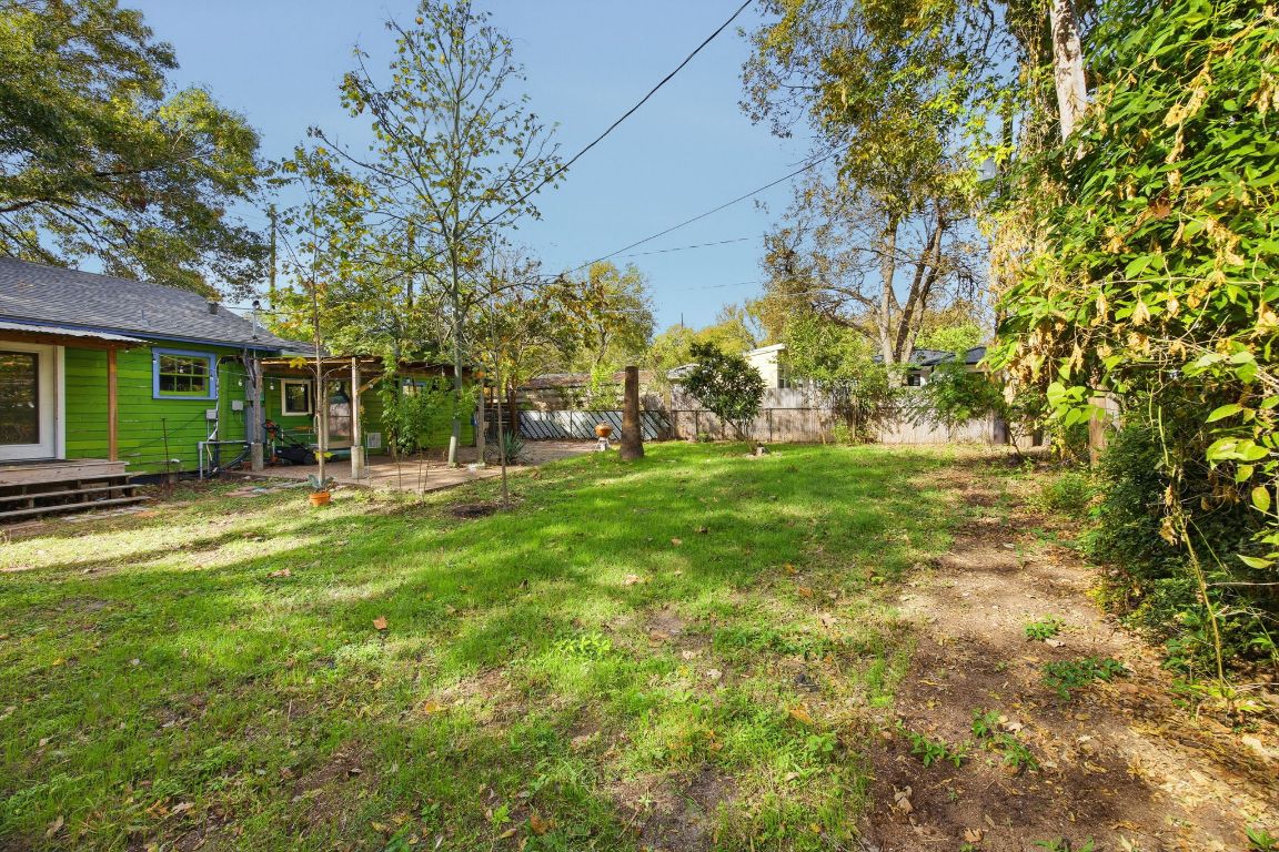 1706 East 38th 1/2 Street Austin, TX 78722 - Photo 22 of 24 a backyard of a house with lots of green space and fountain