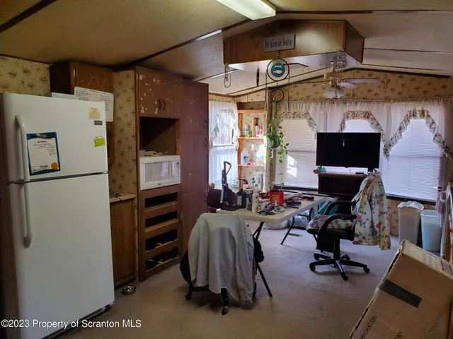 a view of a kitchen with appliances and cabinets