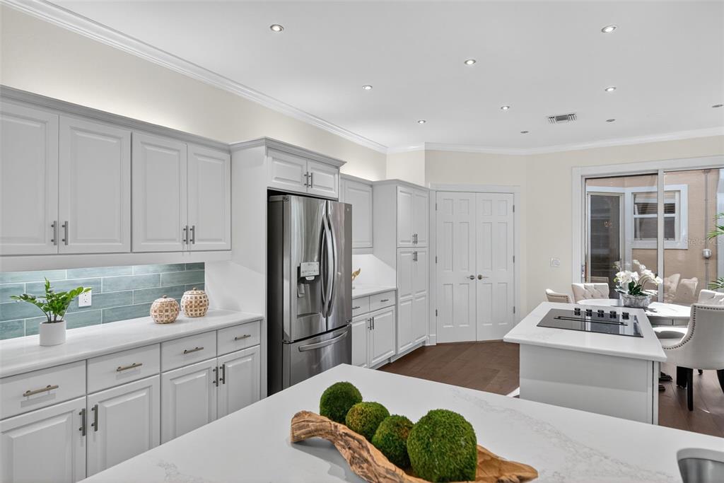 3488 Mistletoe Lane Longboat Key, FL 34228 - Photo 15 of 82 a kitchen with a refrigerator and a sink