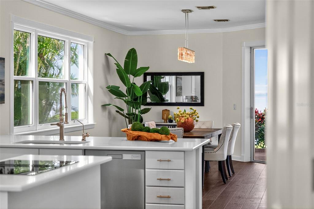 3488 Mistletoe Lane Longboat Key, FL 34228 - Photo 20 of 82 a kitchen with a sink cabinets and window
