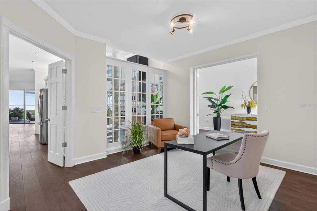 3488 Mistletoe Lane Longboat Key, FL 34228 - Photo 24 of 82 a dining room with furniture potted plants and wooden floor