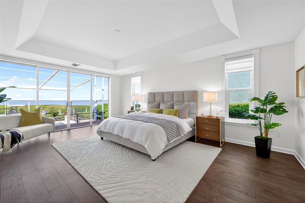 3488 Mistletoe Lane Longboat Key, FL 34228 - Photo 27 of 82 a bedroom with a large bed and a potted plant