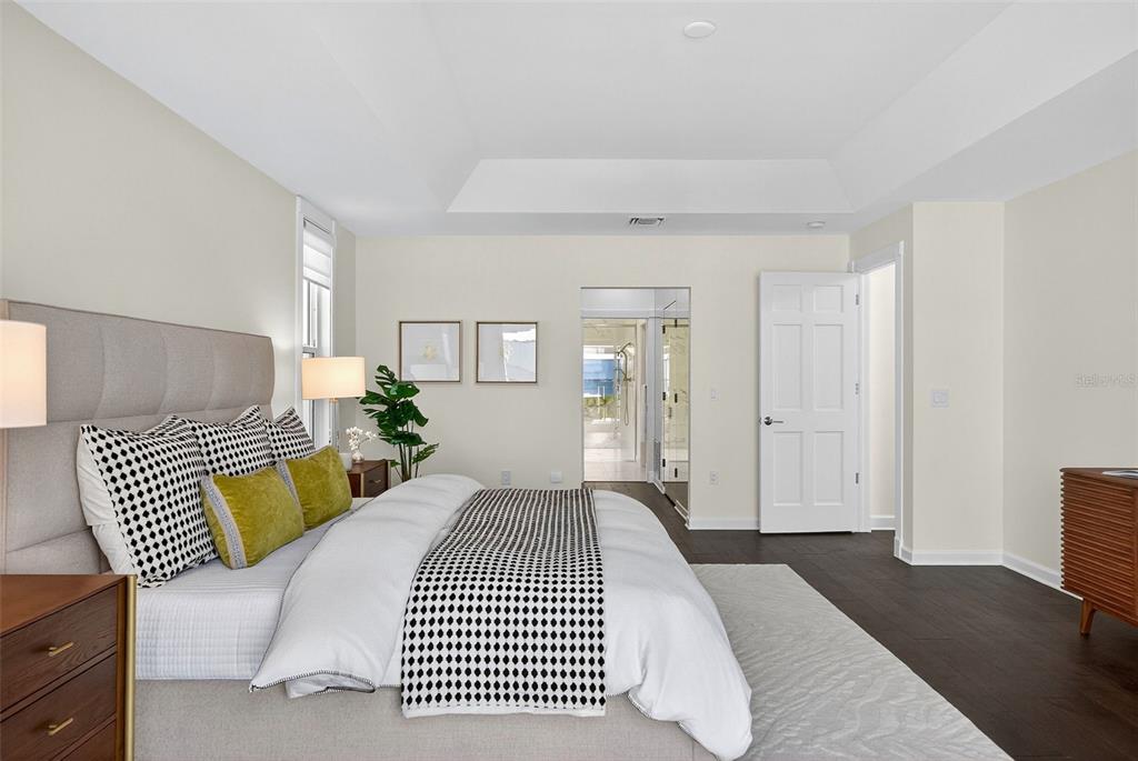 3488 Mistletoe Lane Longboat Key, FL 34228 - Photo 33 of 82 a bedroom with a bed and wooden floor