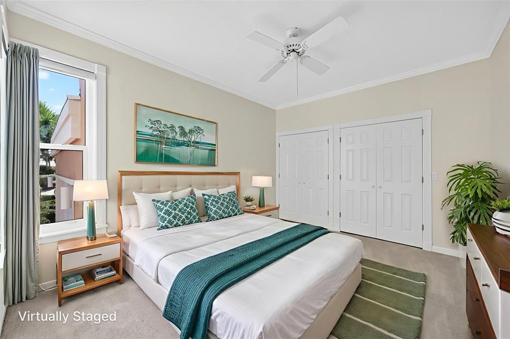 3488 Mistletoe Lane Longboat Key, FL 34228 - Photo 41 of 82 a bedroom with a large bed and a chandelier