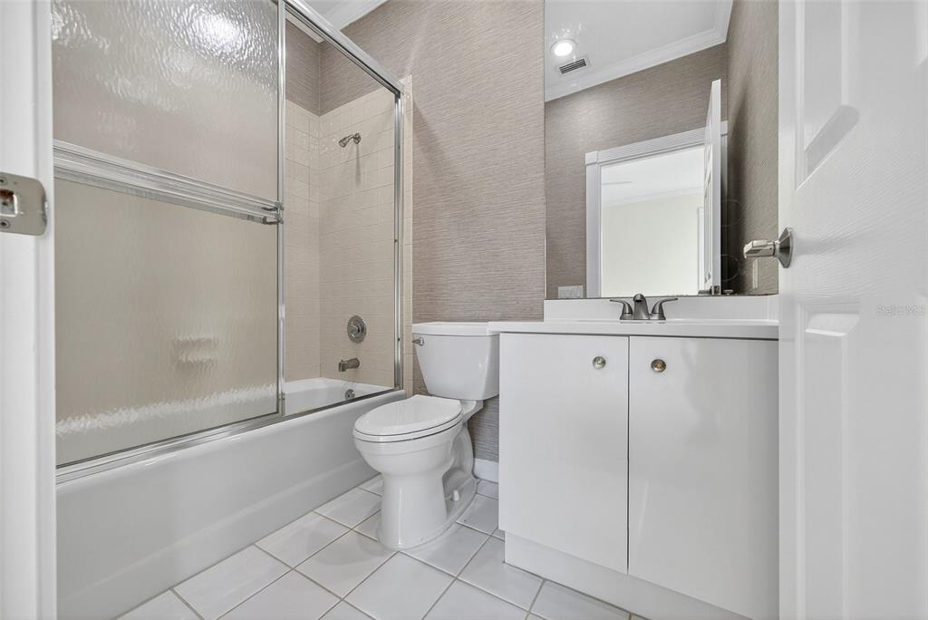 3488 Mistletoe Lane Longboat Key, FL 34228 - Photo 43 of 82 a bathroom with a toilet a sink and a mirror