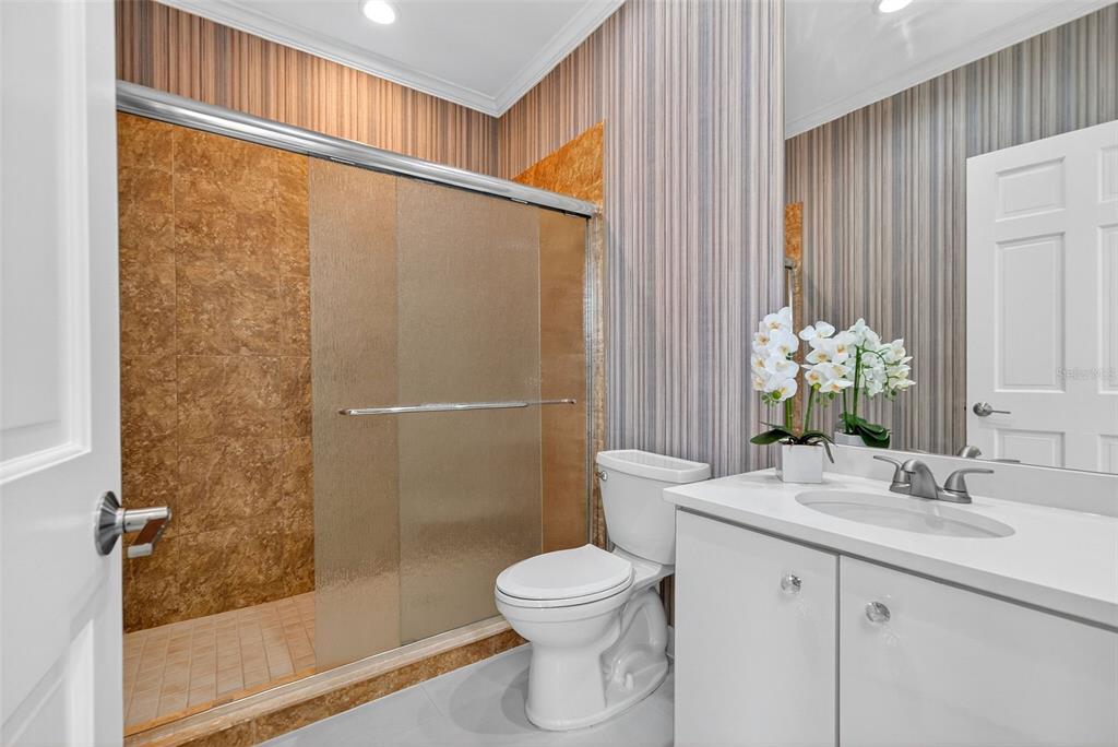 3488 Mistletoe Lane Longboat Key, FL 34228 - Photo 45 of 82 a bathroom with a granite countertop sink toilet and shower