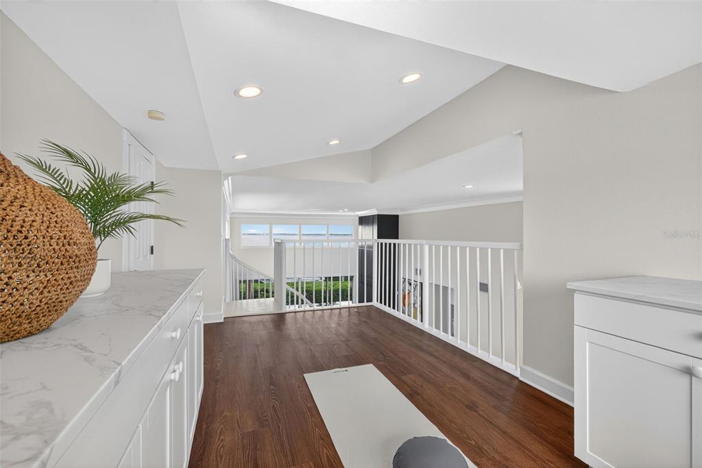 3488 Mistletoe Lane Longboat Key, FL 34228 - Photo 48 of 82 a view of entryway and hall with wooden floor