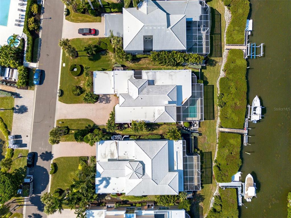 3488 Mistletoe Lane Longboat Key, FL 34228 - Photo 62 of 82 an aerial view of residential houses with outdoor space