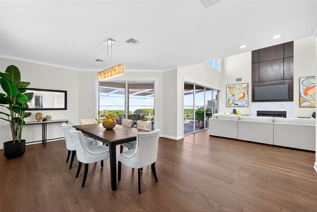3488 Mistletoe Lane Longboat Key, FL 34228 - Photo 8 of 82 a view of a dining room with furniture window and wooden floor