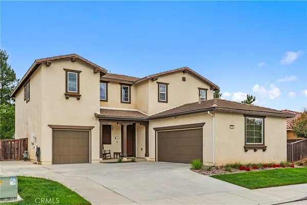 a front view of a house with garage