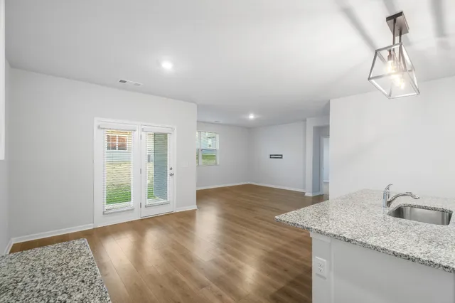 a view of a kitchen with wooden floor