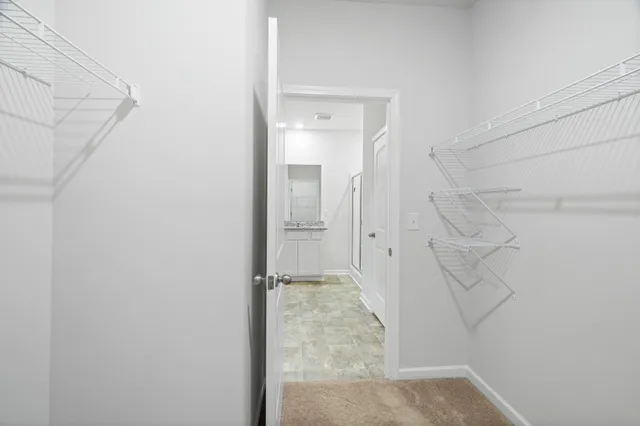 a bathroom with a granite countertop sink mirror and double