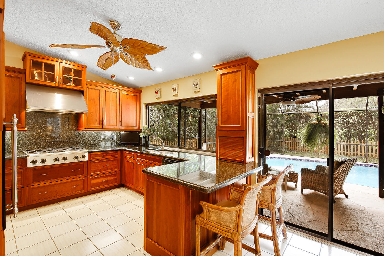 2412 Northwest 35th Street Boca Raton, FL 33431 - Photo 3 of 34 Kitchen and Patio and Pool Areas
