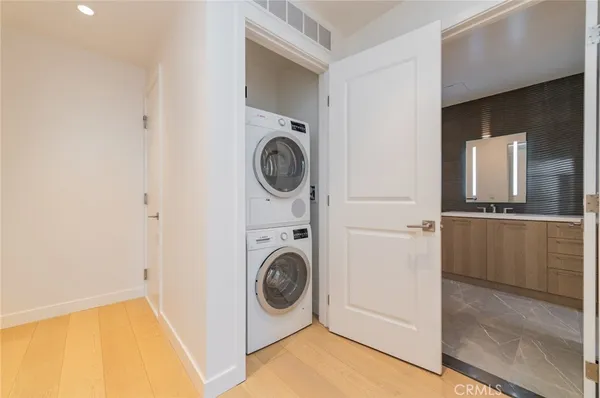 a view of a patio with a table and chairs and potted plants
