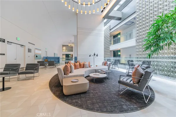 a building outdoor space with patio furniture and potted plants