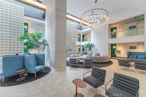 a view of a patio with table and chairs