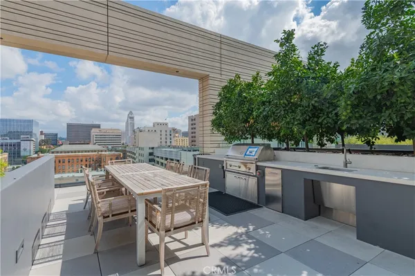 a view of a patio with a table chairs and a table