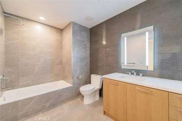 a kitchen with a sink cabinets and stainless steel appliances